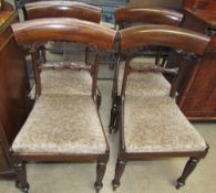 A set of four Regency mahogany dining chairs with leaf carved bar backs and drop in seats on