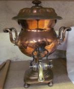A copper samovar with tap to the base