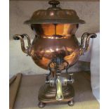 A copper samovar with tap to the base