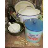 An enamel decorated bread bin together with biscuit tin, pestle and mortar,