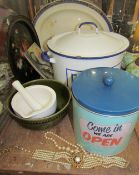 An enamel decorated bread bin together with biscuit tin, pestle and mortar,