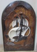 A carved panel depicting a masted ship