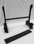 A Japanese hardwood table screen stand, the feet carved as dogs of foo with foot raised on balls,