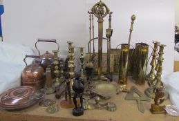 Brass candlesticks together with brass fire irons,