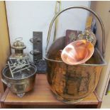 A brass coal scuttle together with a lamp,