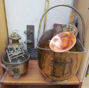 A brass coal scuttle together with a lamp,