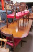 A reproduction mahogany extending dining table together with a set of six reproduction mahogany