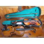 A Skylark Brand violin, 61cm long, cased together with another violin, 58cm long,