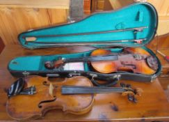 A Skylark Brand violin, 61cm long, cased together with another violin, 58cm long,