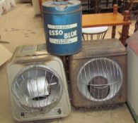 Two radiant oil heaters together with an Esso Blue paraffin tin