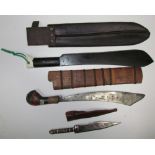 Two machetes together with fishing priests, a dagger,