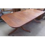 A Regency mahogany extending dining table on twin pillars