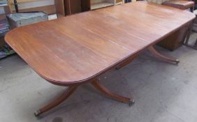 A Regency mahogany extending dining table on twin pillars