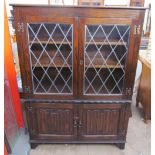 A Jaycee oak bookcase with leaded glazed doors