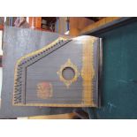 A Royal Piano Harp in a case