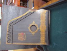 A Royal Piano Harp in a case