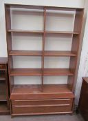 A modern teak bookcase, with eight shelf sections,