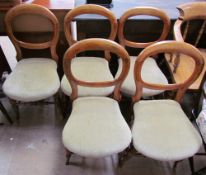 A set of five Victorian mahogany balloon back dining chairs