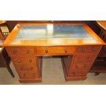 A Victorian mahogany pedestal desk with a leather inset top with a central drawer and two pedestals