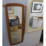 A teak framed wall mirror together with a cream wall mirror