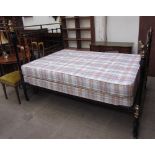 A 20th century brass and iron double bed,