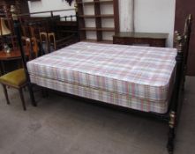 A 20th century brass and iron double bed,
