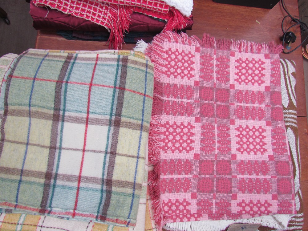 A welsh blanket together with a collection of blankets etc