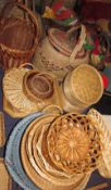 A large collection of wicker baskets and trays