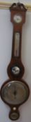 A George III mahogany banjo barometer with a broken swan neck pediment above a hydrometer,