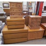 Two oak chests of drawers together with a pair of pine bedside chests of drawers together with a