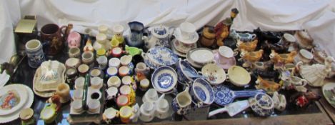 A moulded porcelain part tea set together with cow creamers, tea cups and saucers,