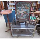 A chrome plated and smoked glass tea trolley together with a fire screen with woolwork panel and a