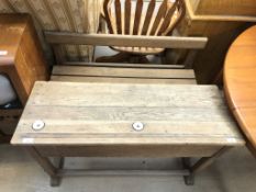 A pine double school desk with ceramic ink inserts