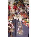 A collection of Japanese dolls in traditional dress with carved and composition heads