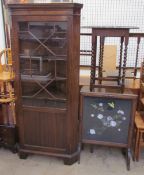 A 20th century mahogany standing corner cupboard together with an oak gate leg dining table,