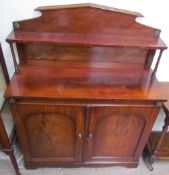A Victorian mahogany chiffonier, with a raised back and shelf with ring turned columns,