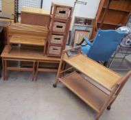 A Danish teak nest of three tables together with a teak magazine rack,