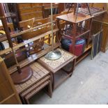 A teak hanging plate rack together with two standard lamps, a tiled top occasional table,