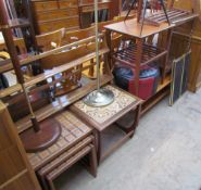 A teak hanging plate rack together with two standard lamps, a tiled top occasional table,