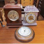An Edwardian mahogany mantle clock, with a brass carrying handle,