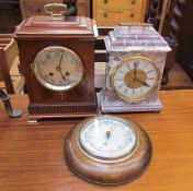 An Edwardian mahogany mantle clock, with a brass carrying handle,