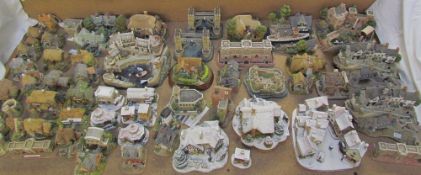 A large collection of Lilliput Lane cottages, including Clovelly, Yuletide Shambles,