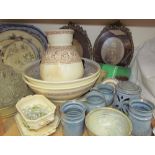 A pottery jug and basin set together with a pottery part dinner set, pottery meat plates,