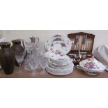 A Royal Worcester Roseland pattern part dinner set together with glass decanters, drinking glasses,