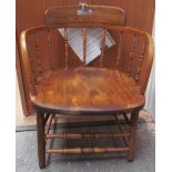 A 19th century stick back captain's chair,