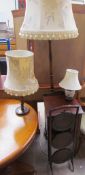 A mahogany standard lamp together with an oak barley twist table lamp,