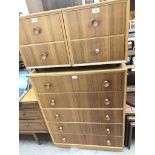 An oak and walnut chest of drawers and a pair of matching bedside cabinets