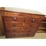 A large 19th century mahogany chest with a central hidden drawer,