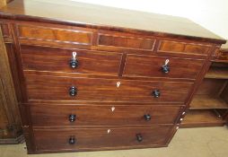 A large 19th century mahogany chest with a central hidden drawer,