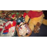 A large Pooh teddy bear together with other teddy bears and Christmas decorations